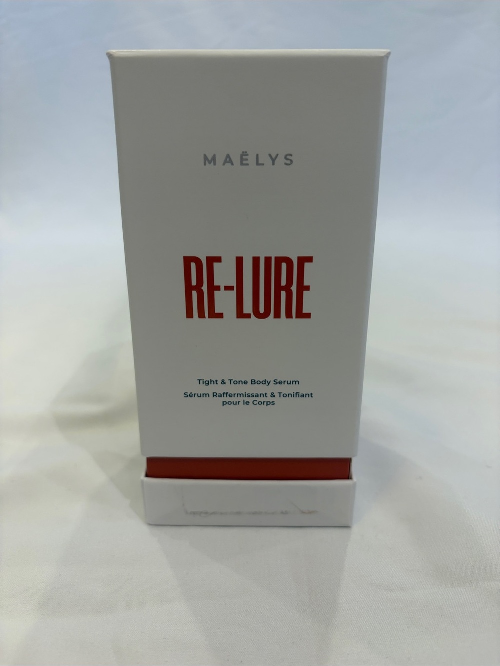 MAËLYS RE-LURE Tight & Tone Body Serum - White with Red Accents